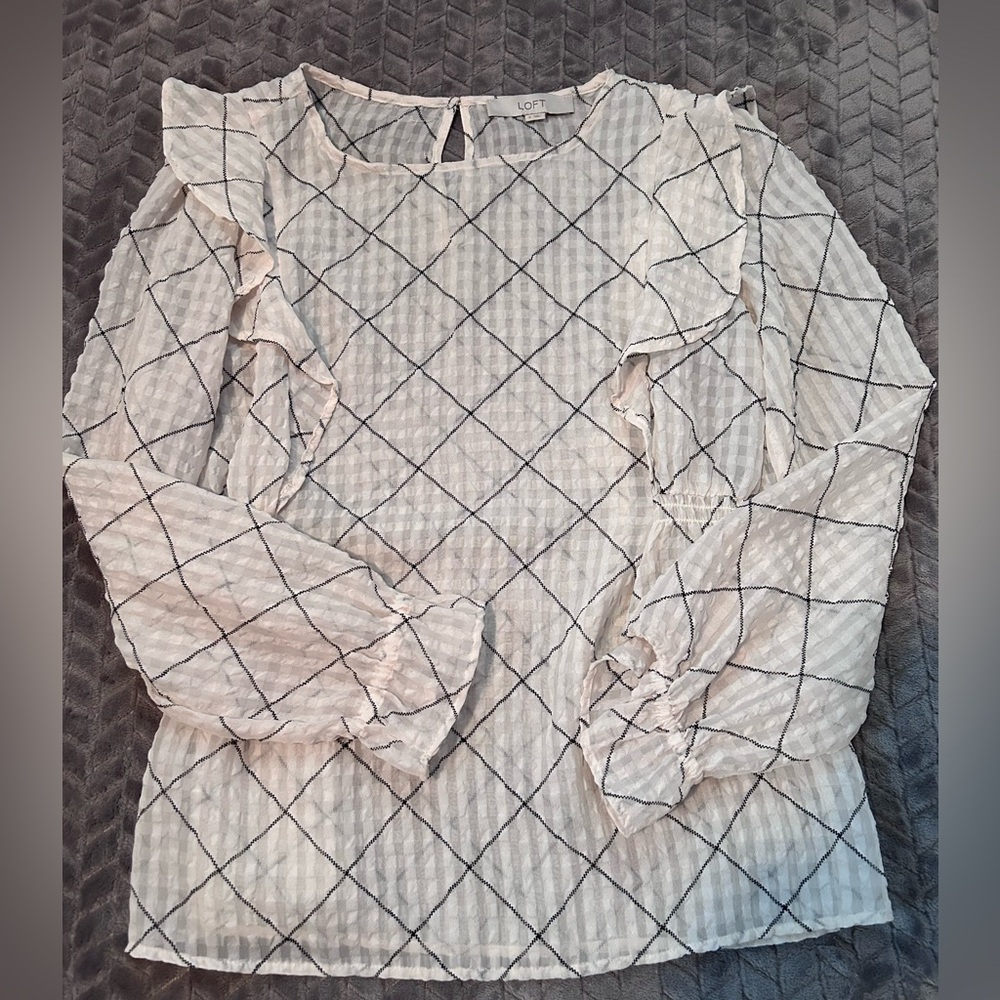 Cream colored blouse with geometric pattern